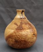 Martin Manuell - A turned Ash vase of gourd shape, with stepped ring turned decoration,
