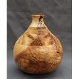 Martin Manuell - A turned Ash vase of gourd shape, with stepped ring turned decoration,