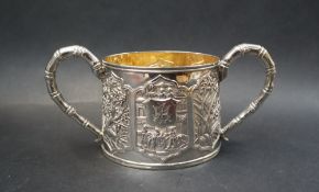 A Chinese silver twin handled sugar basin, decorated with a figural scene and panels of bamboo,