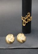 A pair of 9ct gold earrings of oval textured form,