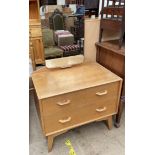 A G-Plan Egomme oak dressing table with two drawers on splayed legs