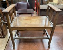 An Arts and Crafts style oak stool,