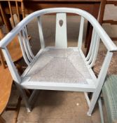 An Arts and Crafts horse shoe shaped chair together with a set of four kitchen chairs,