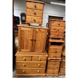 A modern pine chest of drawers together with a pine side cabinet and four pine bedside cabinets