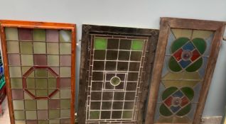 Three leaded and coloured glass panels