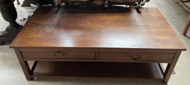 A reproduction hardwood coffee table with two drawers and square legs