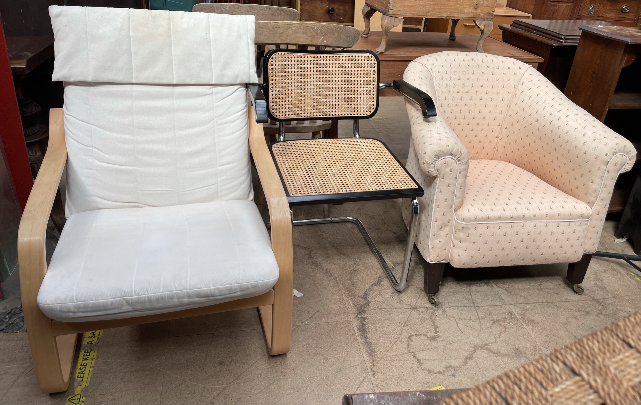 A 19th century horse shoe shaped elbow chair together with a modern chair and a bergere elbow chair