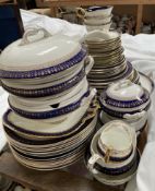 A wedgwood blue and white, gilt decorated part dinner set,