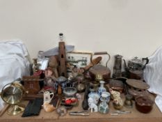 A Seth Thomas quartz gimbal mounted desk clock together with a copper lighthouse table lamp,