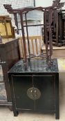 A black lacquer side cabinet together with a Chinese folding stand