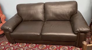 A brown leather two seater settee on square tapering legs