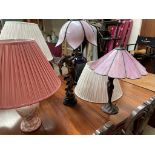 Two Art Nouveau inspired table lamps together with seven other table lamps