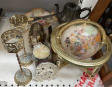 A gem set globe, together with brass candlesticks,