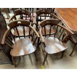 A set of four smokers bow elbow chairs,