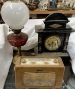 A simulated black slate mantle clock,