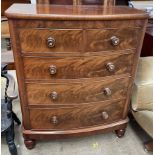 A Victorian mahogany chest the D shaped top above two short and three long graduated drawers on