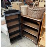 A stained pine bookcase together with a stained oak bookcase a wicker waste paper bin and a wicker