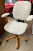 An upholstered swivel office chair