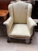 An early 20th century wing back library chair,