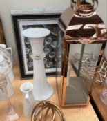 A copper storm lantern together with a large collection of lamps, vases, storage jars, prints,