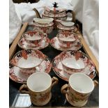 A Royal Crown Derby part tea set, comprising a teapot, cream jug,