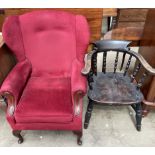 A smokers bow elbow chair with a spindle back and solid seat on turned legs together with an