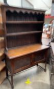 An oak dresser, the rack with two shelves,