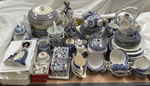 A blue and white willow pattern part dinner service together with other blue and white pottery,