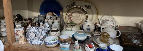 A continental porcelain clock and figures together with dog figures part tea sets,