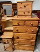 A tall modern pine chest of drawers together with a pine bedside chest, pine bedside cabinet,