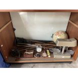 Assorted golf clubs together with a scales, globe,