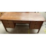 A mid 20th century teak desk,