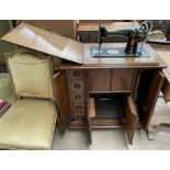 A Singer treadle sewing machine, with rise and fall action,