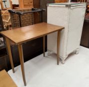 A white painted wicker bedside cabinet together with an occasional table