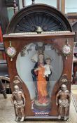 A table top altar piece with shell carved frieze and glazed door,