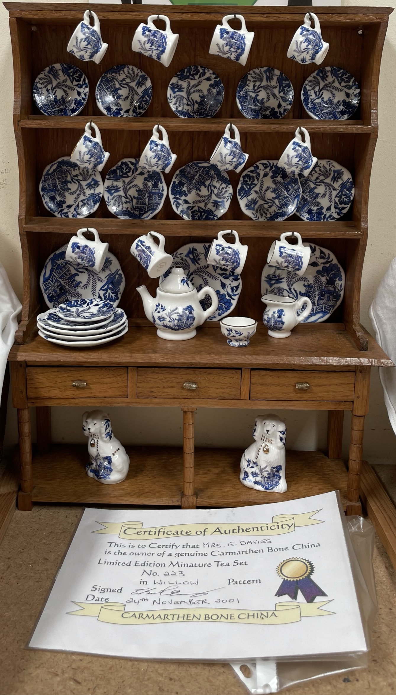 A Miniature South Wales style oak dresser together with a Carmarthen bone china blue and white