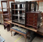 An oak refectory dining table together with three bookcases, a reproduction mahogany bedside chest,