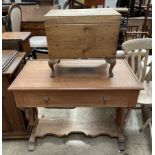 A mahogany desk with a rectangular top and a faux drawers on lyre supports,