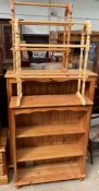 Two pine bookcases together with two towel rails