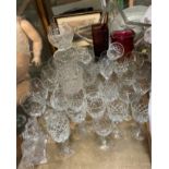 Coloured glass vases together with assorted drinking glasses and glass bowls etc