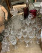 Coloured glass vases together with assorted drinking glasses and glass bowls etc