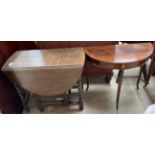 A 20th century oak gateleg dining table together with a mahogany half round table on reeded legs