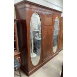 An Edwardian mahogany triple wardrobe,