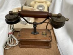 A Telematic telephone together with two cream bakelite telephones