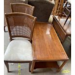 A reproduction yew coffee table together with a pair of modern bergere dining chairs