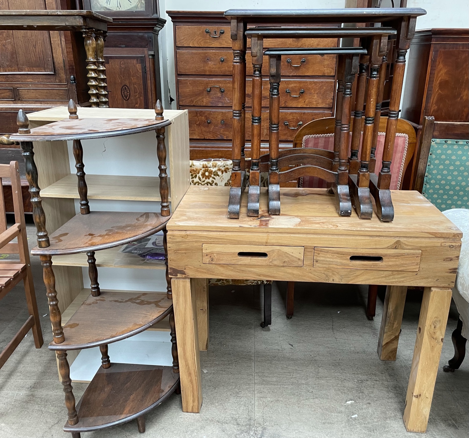 A nest of three oak tables together with a modern desk,