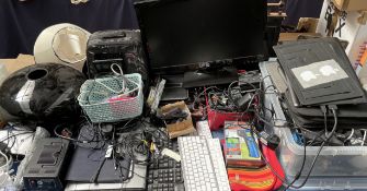 A Dell laptop computer together with a large collection of computer accessories, cables, monitor,