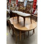 A G-Plan teak extending dining table and six chairs