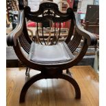 A carved Italian X frame chair,