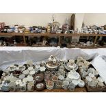 A collection of pottery pot lids, together with a large quantity of commemorative china,